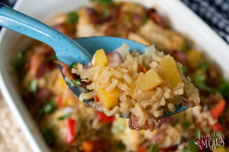 Aloha Pineapple Chicken Rice Casserole - Blue serving spoon scooping out casserole