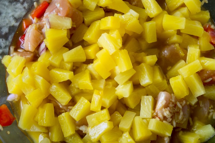 Aloha Pineapple Chicken Rice Casserole - Pineapple with juices poured into glass bowl