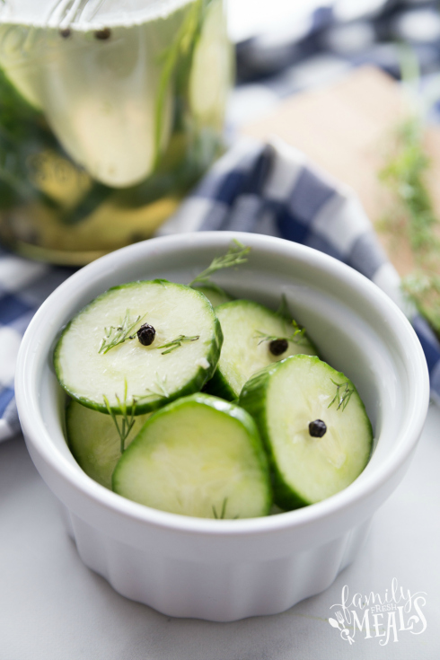 Easy Refrigerator Pickles - Cucumber pickles served in a small white bowl