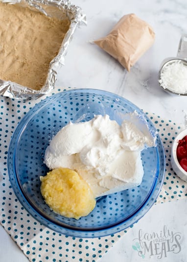 Pina Colada Lush Cake - cake mix in a blue glass bowl