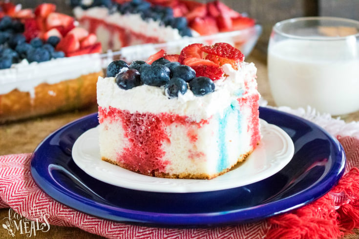 Red White and Blue Poke Cake - A slice of cake on a blue plate