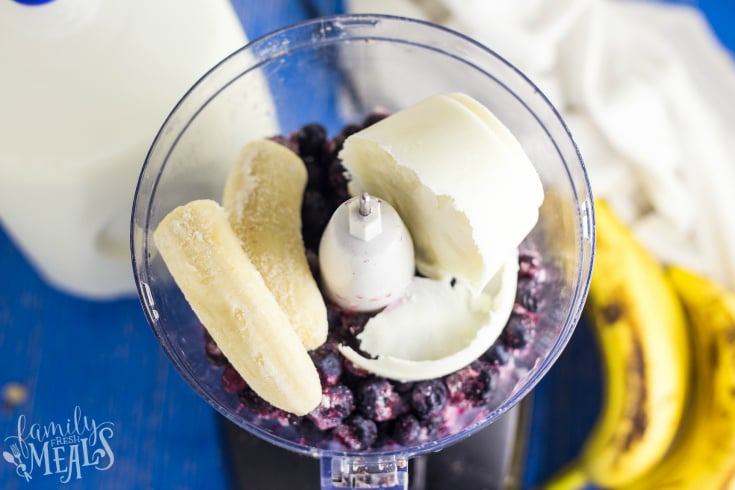 Blueberry Muffin Smoothie Bowl - Frozen banana, frozen yogurt, and frozen blueberries in a food processor