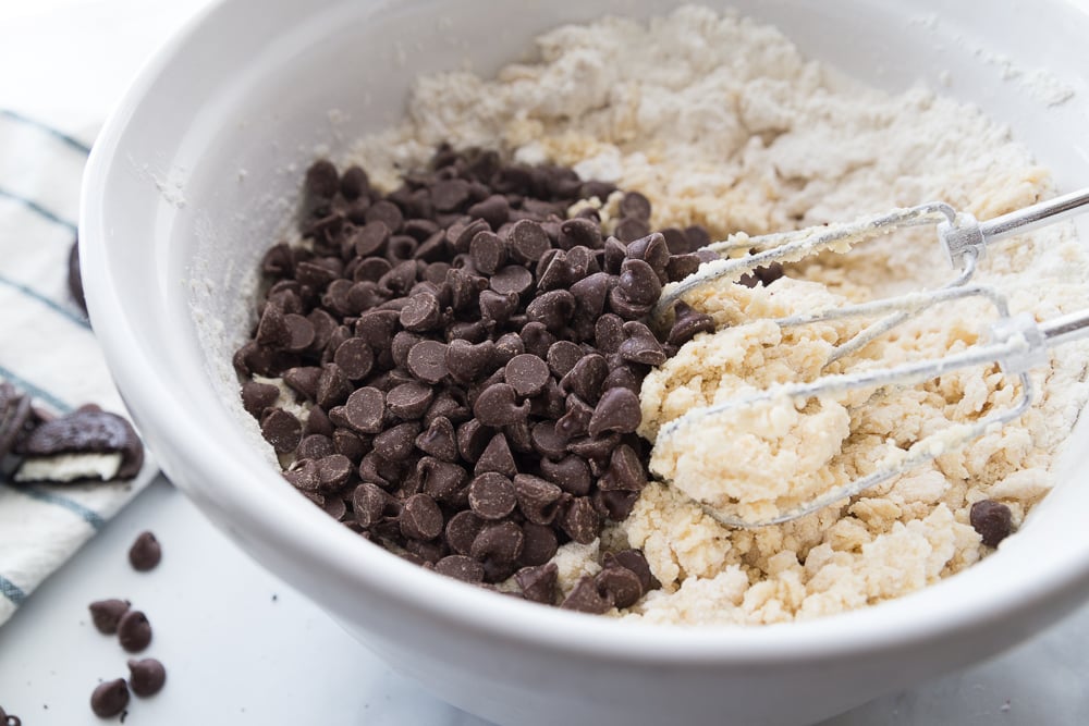 Jumbo Oreo Stuffed Chocolate Chip Cookies - Chocolate chips, flour, butter and vanilla in a bolw