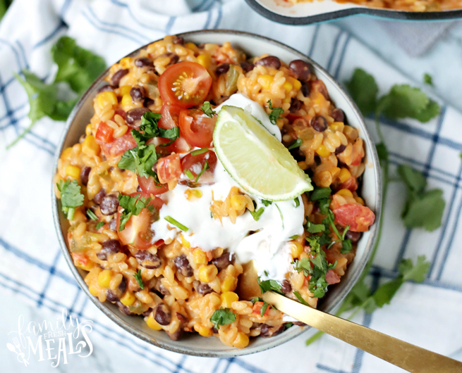 Cheesy Enchilada Orzo Recipe - Served in a bowl and topped with sour cream and lime