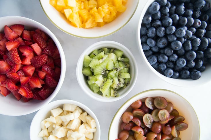 Honey Glazed Fruit Salad - Fruit cup up in white bowls