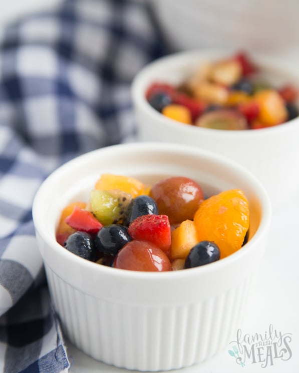 Honey Glazed Fruit Salad Recipe - served in small white bowls - Family Fresh Meals