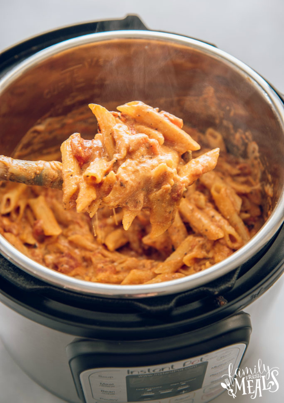 Instant Pot Three Cheese Ziti Recipe - Pasta scooped up with a wooden spoon