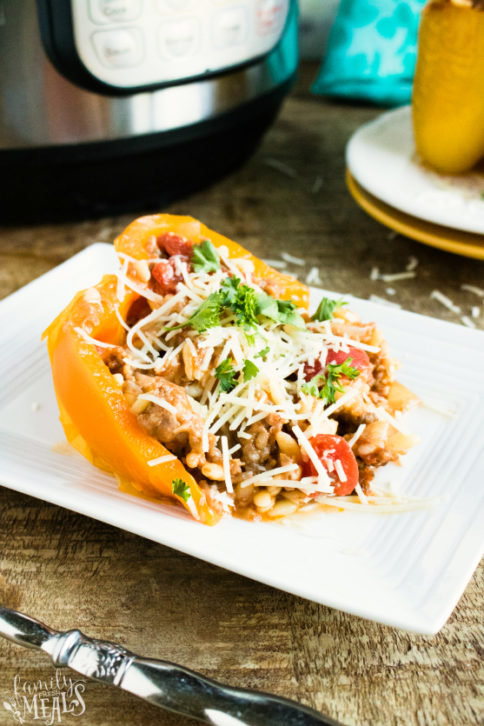 Instant Pot Orzo Sausage Stuffed Peppers Recipe - Served on a white plate