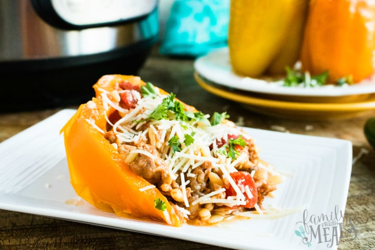 Instant Pot Orzo Sausage Stuffed Peppers - Served on a white plate