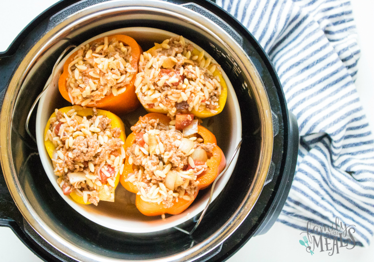 Instant Pot Orzo Sausage Stuffed Peppers - Stuffed peppers resting in instant pot