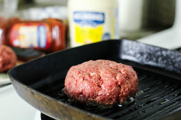 The Best Burgers Recipe - burger cooking on a griddle pan - Family Fresh Meals