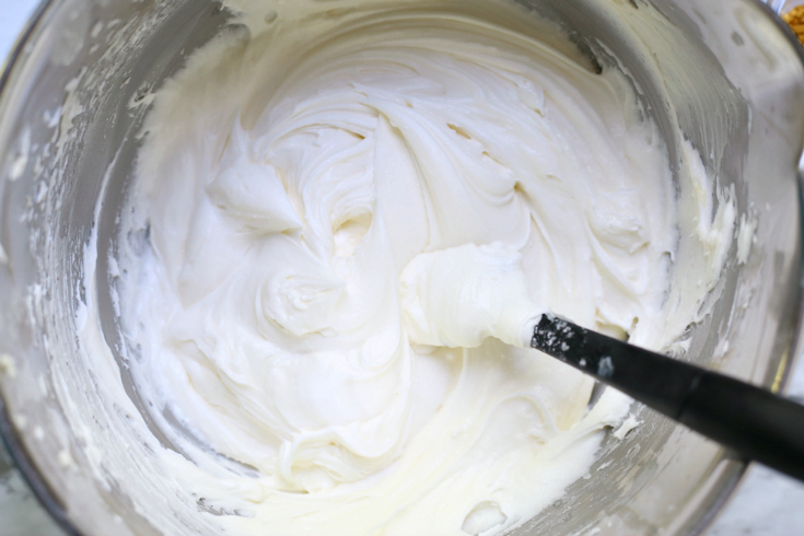 Unicorn Cereal Bars - Buttercream frosting being mixed in a mixing bowl