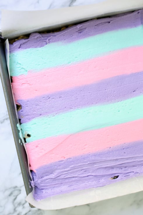 Unicorn Cereal Bars - Colorful Buttercream frosting smoothed over the top of the cereal bars