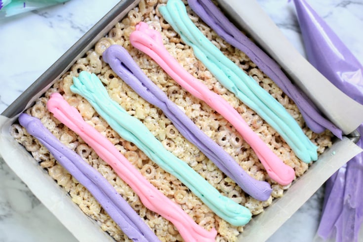 Unicorn Cereal Bars - Lines of pastel colored buttercream frosting