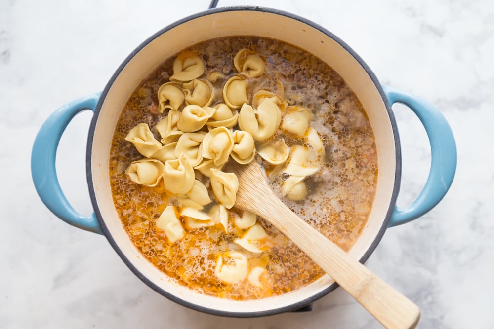 Italian Tortellini Soup Recipe - Tortellini being stirred in to soup