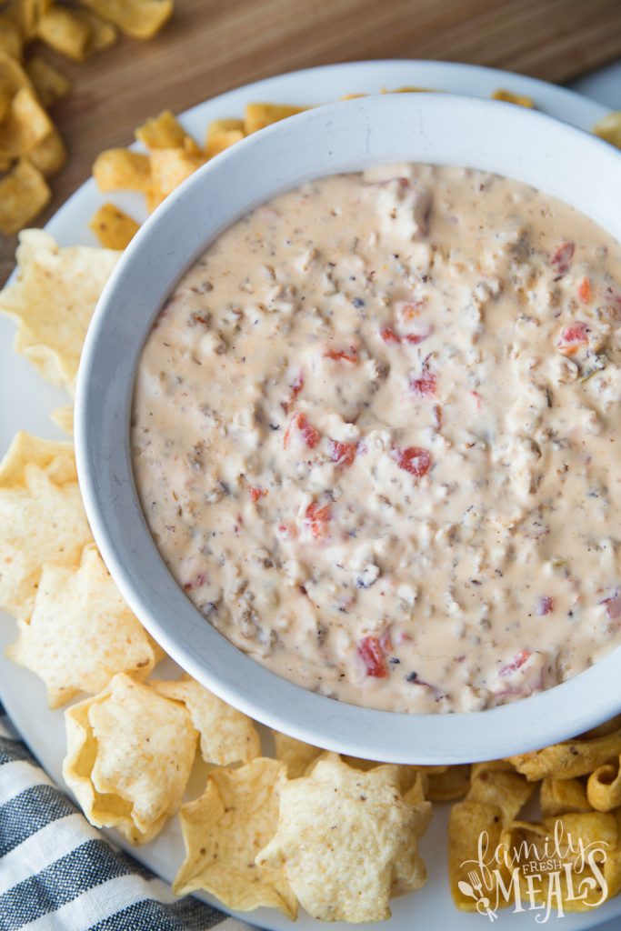 Cheesy Sausage Dip - Served in a white bowl with chips