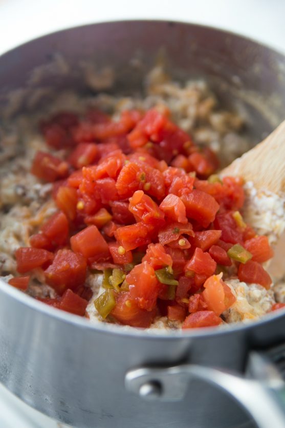 Cheesy Sausage Dip - Stir in rotel diced tomatoes