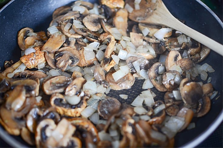 Crockpot Beef with Mushroom Gravy - Cooked mushrooms and onions in pan