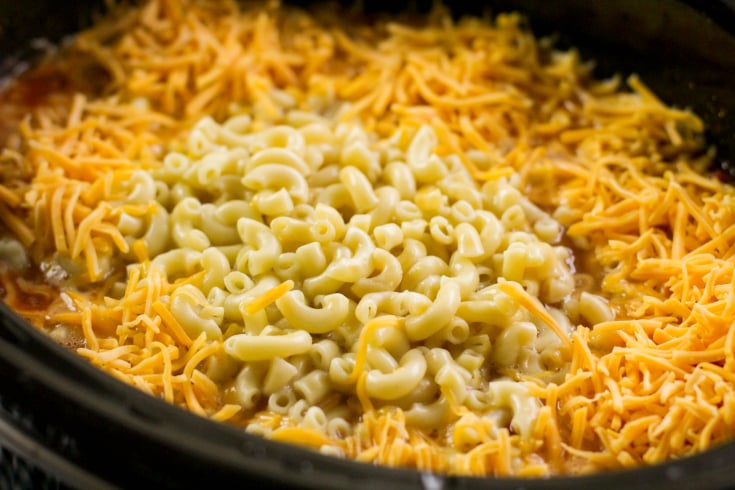 Crockpot Cowboy Chicken Chili Mac - Cooked noodles and shredded cheese added on top to chili