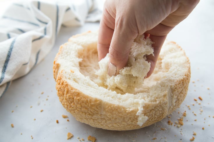 Pull Apart Cranberry Brie Bread Bowl - removing bread from bread bowl to fit brie cheese wheel