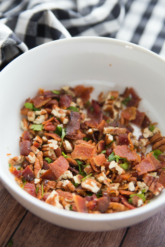 Savory Bacon Cheese Ball - cream cheese, chopped bacon, nuts and seasoning in a small white bowl