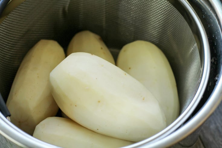 Instant Pot Mashed Potatoes - peeled potatoes in instant pot basket