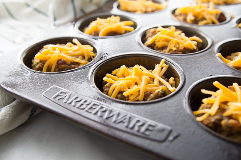 Mini Meatloaf Cupcakes - mini meatloaf topped with shredded cheese