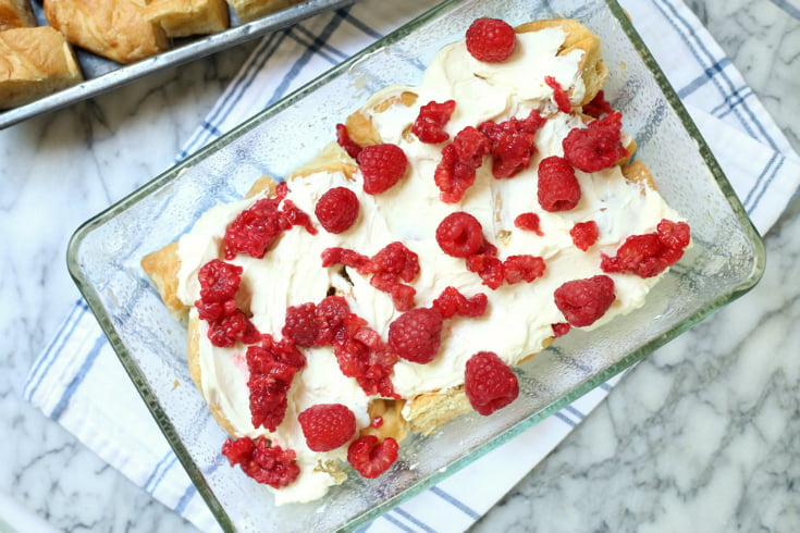 Raspberry Cheesecake Breakfast Bake - creamy cheesecake mixture spread over bread and topped with fresh raspberries