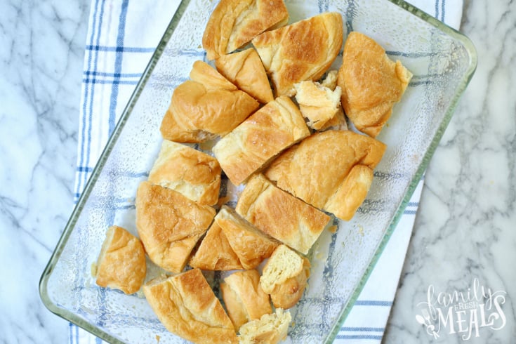 Raspberry Cheesecake Breakfast Bake - crossiant bread broken into pieces in a baking dish