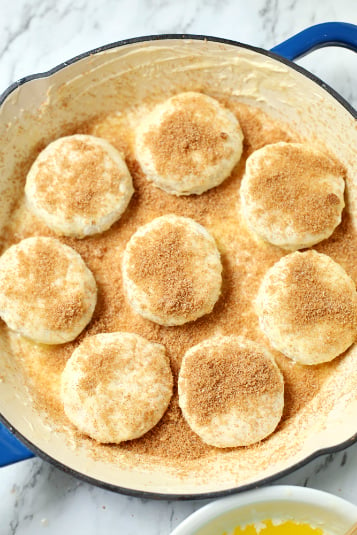 Skillet Apple Pie Dessert Biscuits - biscuits in a prepared skillet topped with cinnamon sugar