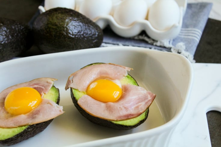 Avocado Egg Bake - egg filled avocados placed in a baking dish