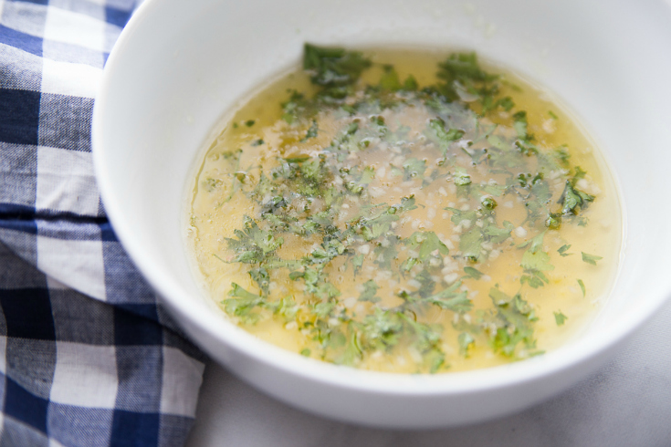 Honey Baked Salmon - Melted butter and seasoning in a white bowl