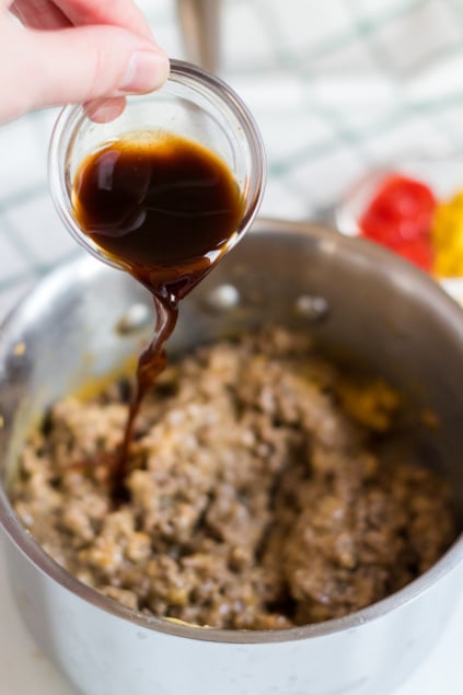 Bacon Cheeseburger Dip - Adding sauce to ground beef in pot