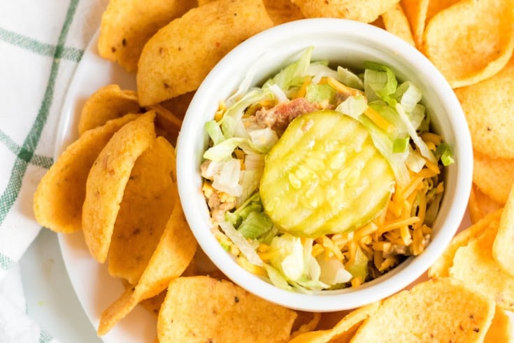 Bacon Cheeseburger Dip - Dip served in a small white dish and corn chips