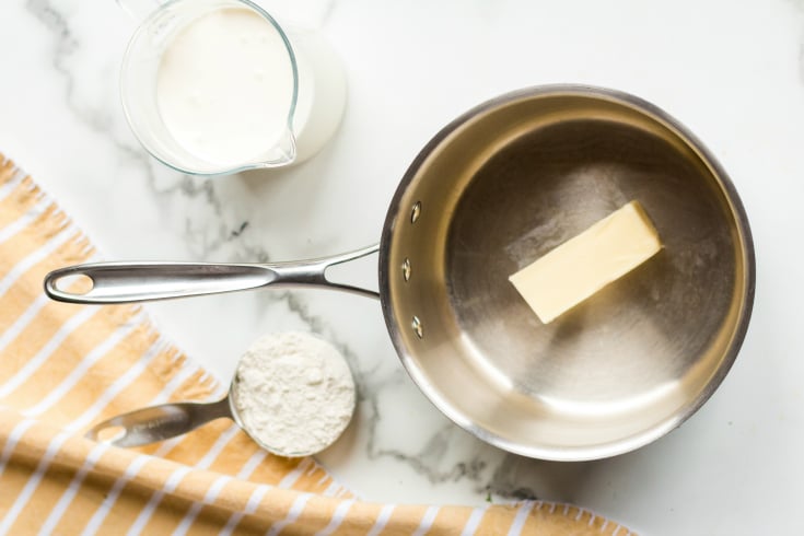 Instant Pot Creamy Chicken Wild Rice Soup Recipe - butter in small pan with flour and milk in measuring cup