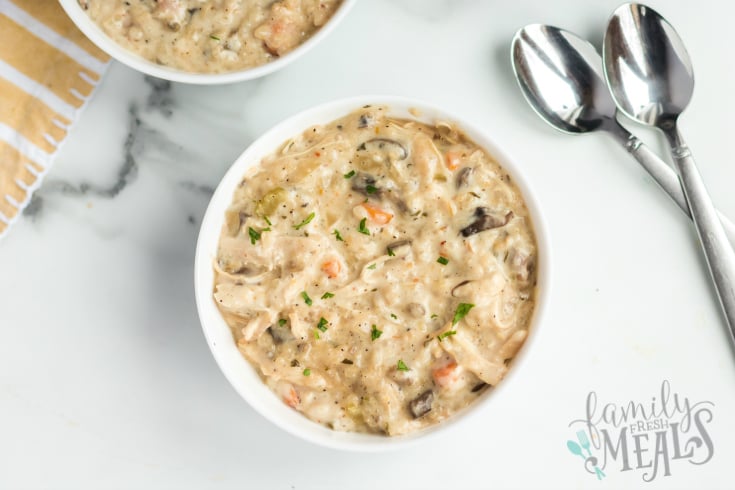 Instant Pot Creamy Chicken Wild Rice Soup - Served in a white bowl - FamilyFreshMeals.com