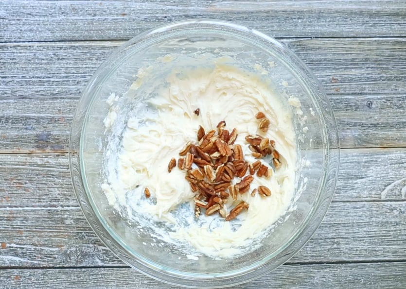 Butter Pecan Brownies Recipe - butter pecan icing with walnuts in a bowl