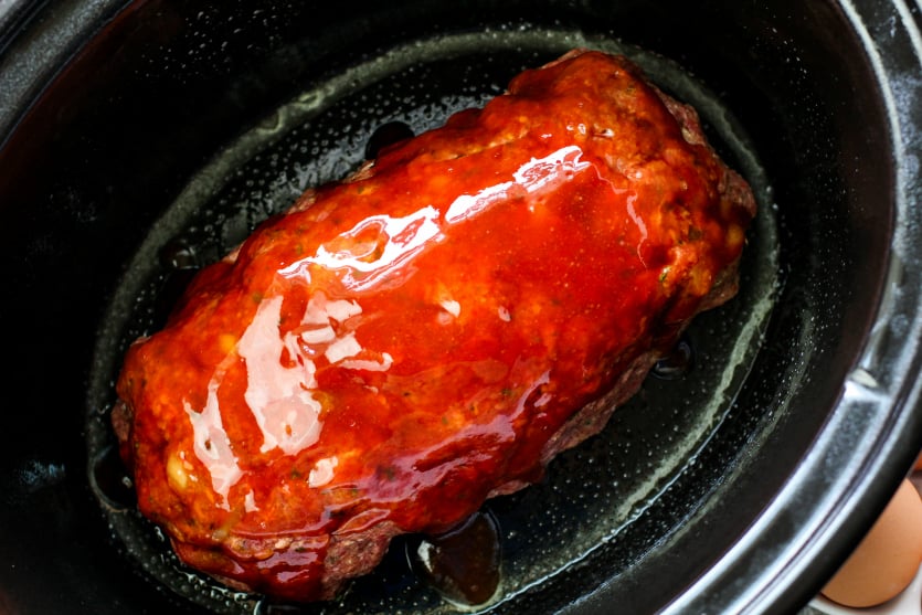 Crockpot Meatloaf Dinner - sauce placed on slow cooker meat loaf - Family Fresh Meals
