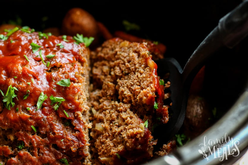 Easy Crockpot Meatloaf Dinner - serving a slice of meat loaf - Family Fresh Meals