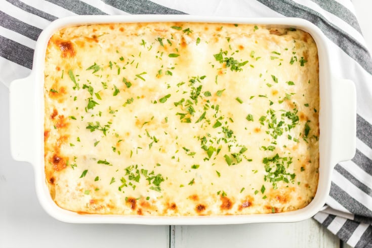 Easy Seafood Lasagna - Baked until cheese is golden and topped with parsley - Family Fresh Meals