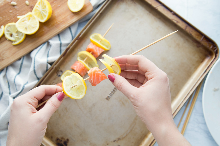 Lemon Salmon Kabobs - How to make salmon kabobs - placing lemon and salmon on kabob stick