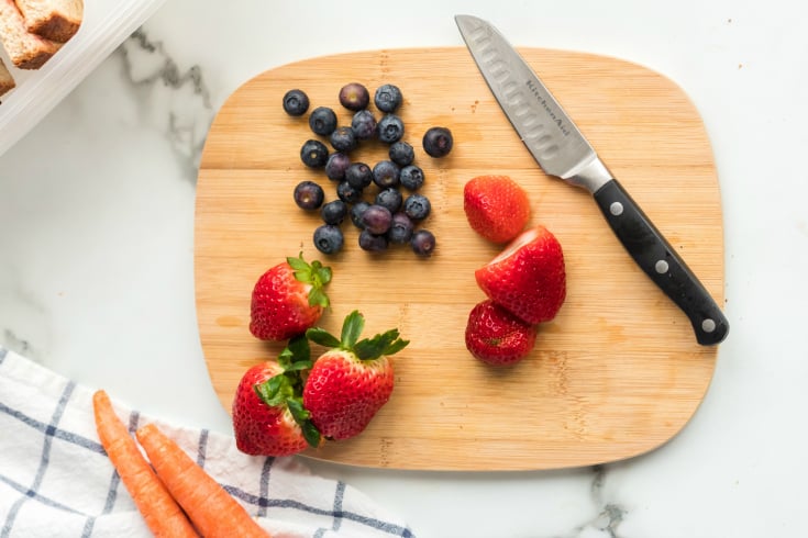 Peanut Butter Jelly Protein Box - Berries on cutting board with knife