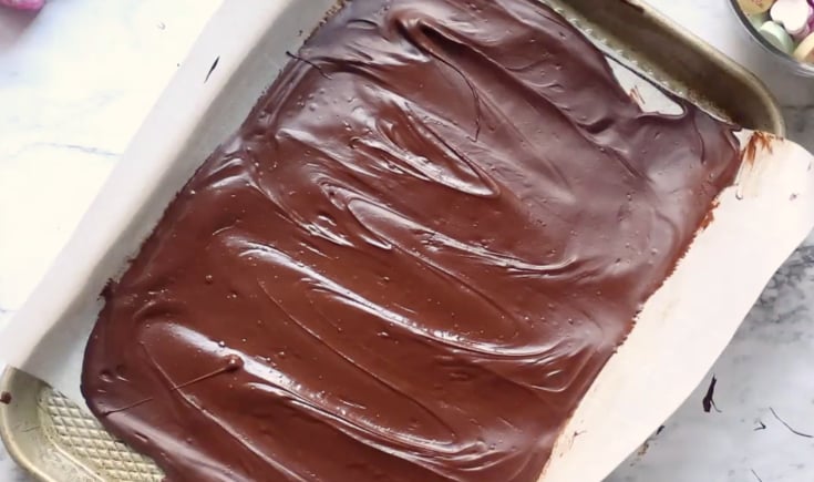 Valentine's Day Chocolate Bark - melted chocolate chips spread out on baking dish