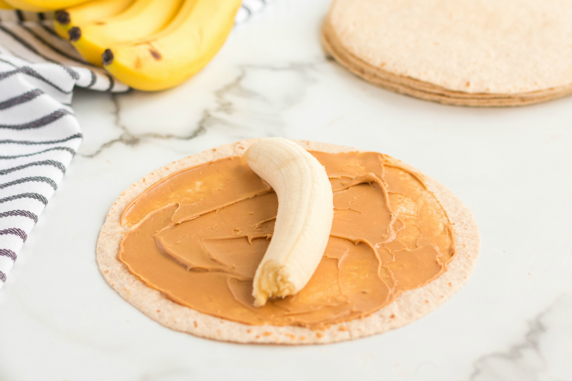 Banana Roll Up Lunch Box Idea - banana on peanut butter and tortilla