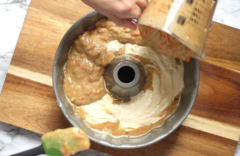 Cream Cheese Carrot Bundt Cake - adding cake mix to top of cream cheese - Family Fresh Meals