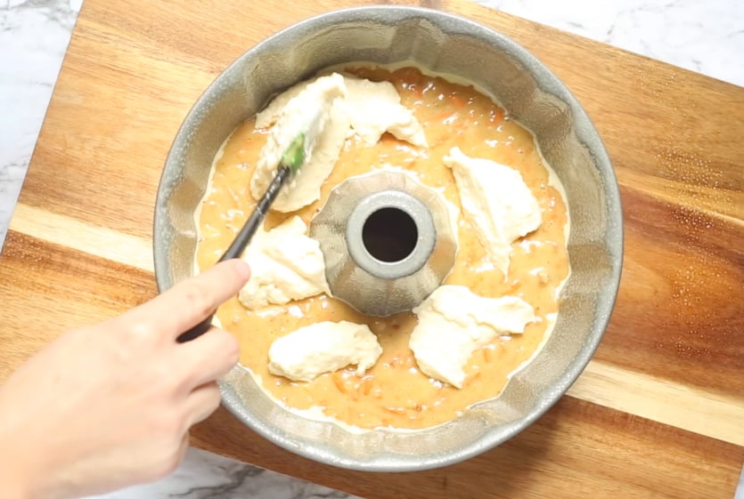 Cream Cheese Carrot Bundt Cake - placing cream cheese on top of cake batter - family fresh meals