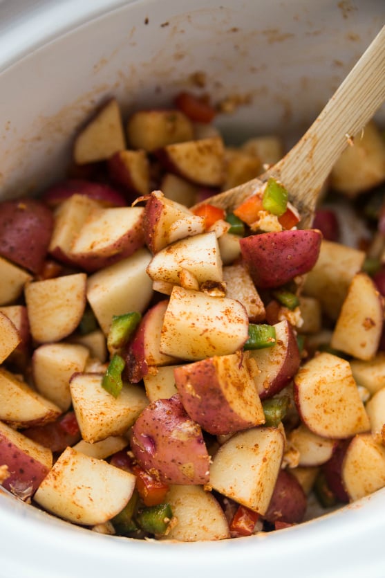 Crockpot Country Potatoes Recipe -Stir potatoes peppers and onions in slow cooker - Family Fresh Meals 