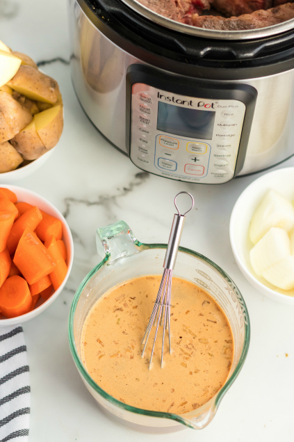 Instant Pot Pot Roast Dinner - marinade mixed in a glass mixing cup - Family Fresh Meals