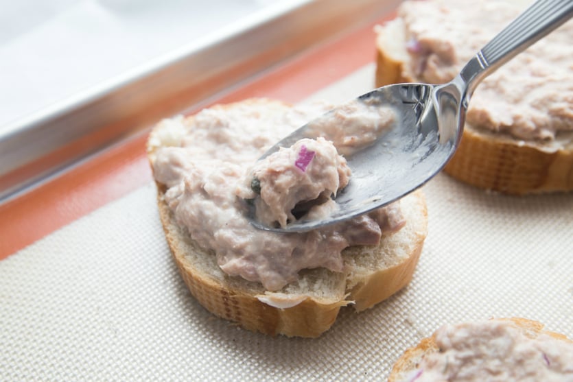 Spreading tuna salad mixture on bread - Family Fresh Meals