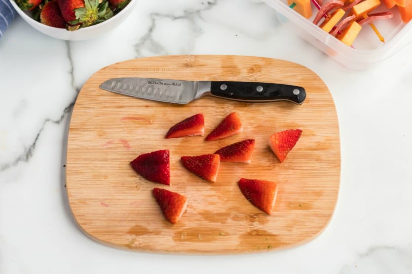 Salami Cheese Kabobs Lunchbox - Sliced strawberry on cutting board - Family Fresh Meals